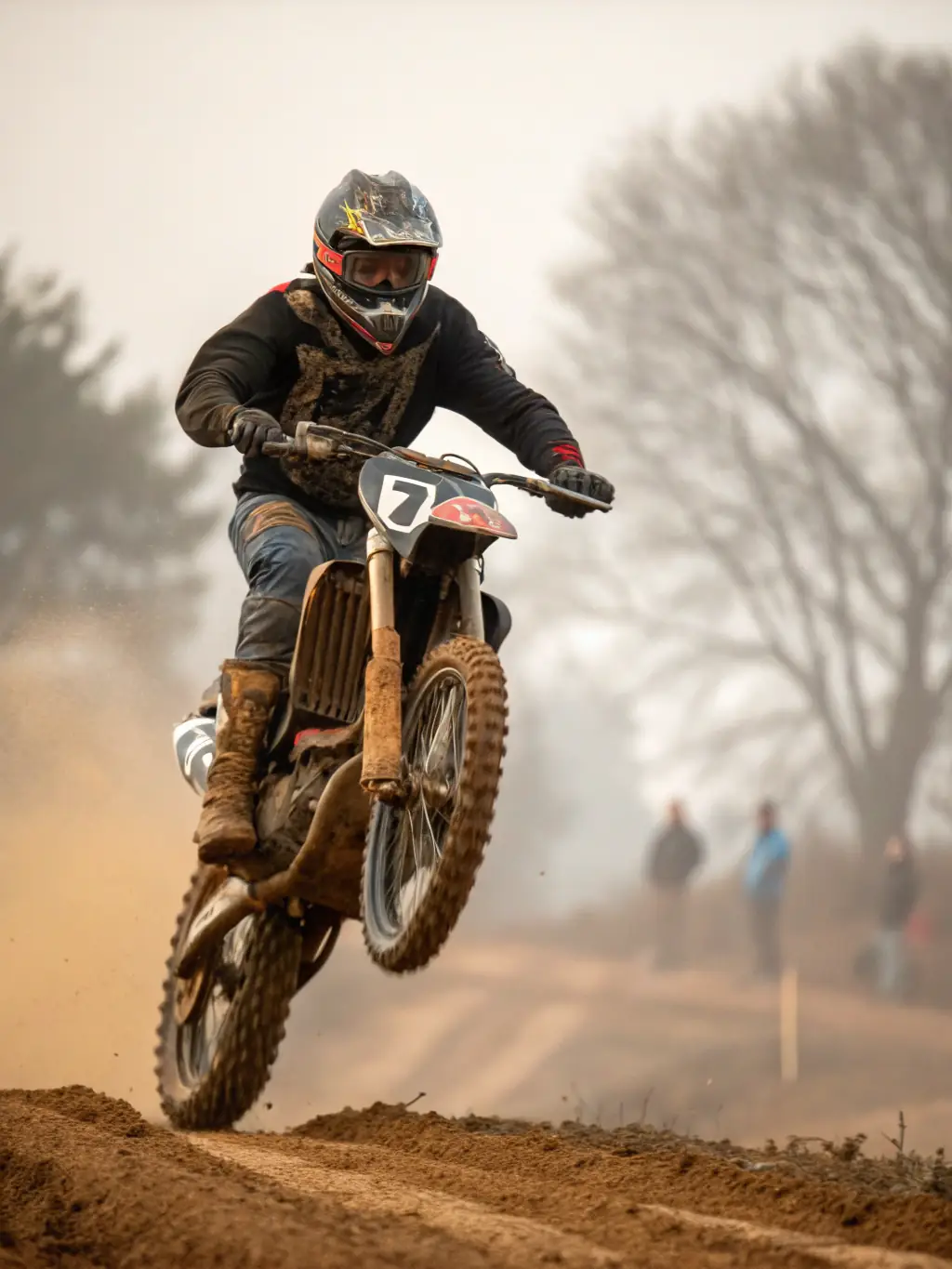 Action shot of a young motocross rider skillfully navigating a turn on a dirt track at MXBEYNAT, showcasing the youth program in action.
